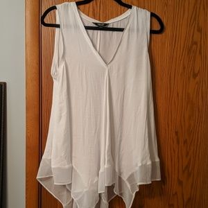 White, flowy, sleeveless women's top.